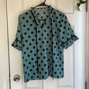 Blue with black polka dot blouse. Ruffle collar and sleeves.